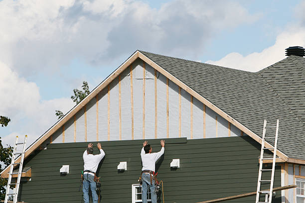 Professional Siding technician working in Rome, NY